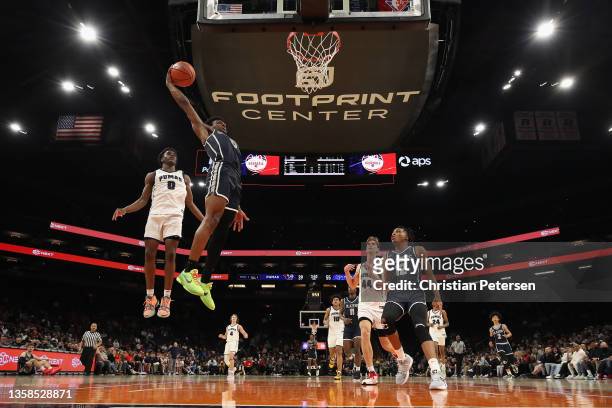 Bronny James of the Sierra Canyon Trailblazers slam dunks the ball past of Ben Egbo of the Perry Pumas during the Hoophall West tournament at...