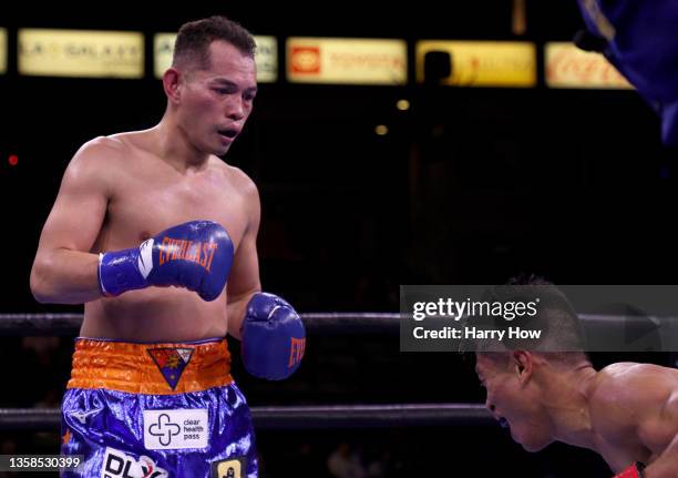 Nonito Donaire watches as Reymart Gaballo reacts to a body shot resulting in a third round knockout win for the WBC World Bantamweight Championship...