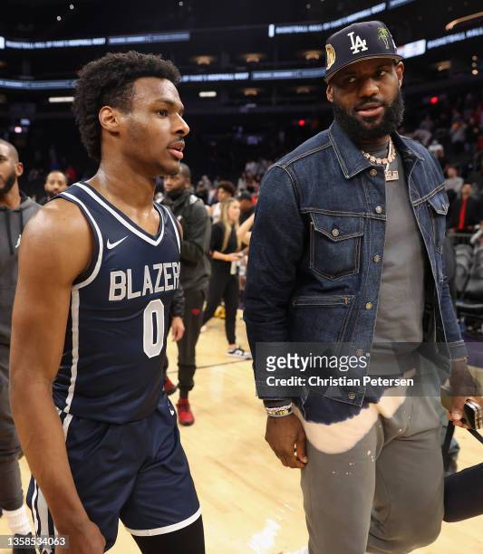 Bronny James of the Sierra Canyon Trailblazers and father LeBron James of the Los Angeles Lakers walk off the court following the Hoophall West...