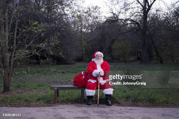 outdoor portrait of santa claus waiting for nightfall - claus lange stock pictures, royalty-free photos & images
