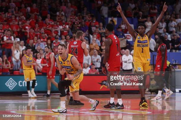 Nathan Sobey and Robert Franks of the Bullets celebrate winning after double overtime during the round two NBL match between Perth Wildcats and...