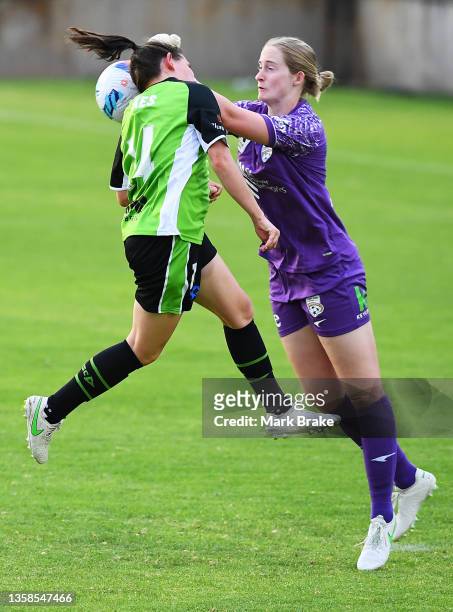 Annalee Grove goalkeeper of Adelaide United saves in front of Ashleigh Sykes of Canberra United during the round two A-League Womens match between...