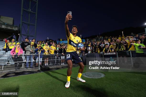 Daniel Hall of the Mariners takes a selfie with fans after the game during the A-League mens match between Central Coast Mariners and Sydney FC at...