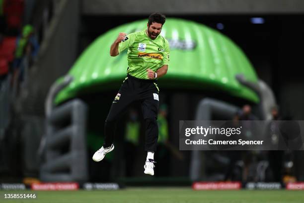 Ben Cutting of the Thunder celebrates dismissing Nick Larkin of the Stars during the Men's Big Bash League match between the Sydney Thunder and the...