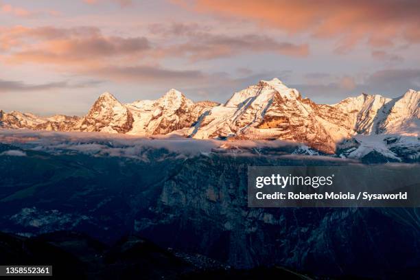 aerial view of mount eiger at sunset, switzerland - eiger mönch jungfrau stockfoto's en -beelden