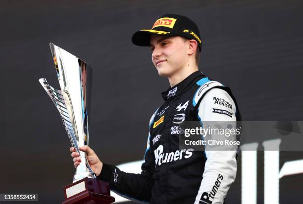 Race winner Oscar Piastri of Australia and Prema Racing celebrates on the podium during the feature race of Round 8:Yas Island of the Formula 2...