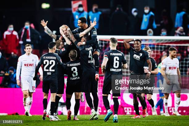 Niklas Dorsch of Augsburg celebrates scoring his team's second goal during the Bundesliga match between 1. FC Köln and FC Augsburg at...