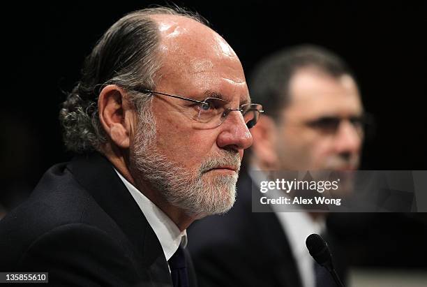 Former chairman and CEO of MF Global and former New Jersey Governor Jon Corzine and COO of MF Global Bradley Abelow testify during a hearing before...