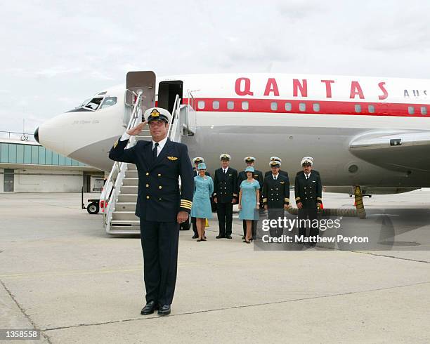 Actor John Travolta salues after arriving in his Quantas 707 "Jett Clipper Ella" on the final stop of his round the globe "Spirit Of Friendship" tour...