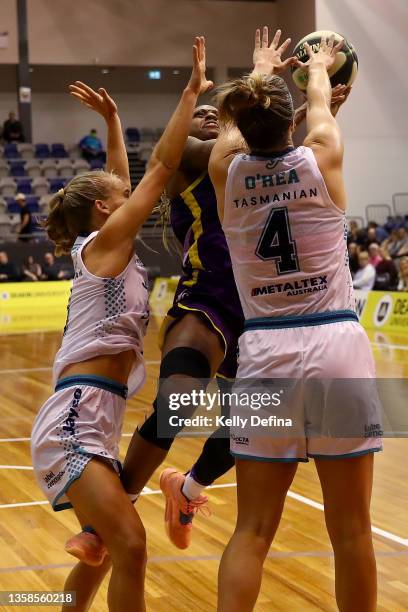 Tiffany Mitchell of the Boomers drives to the basket against Jenna O’Hea of the Flyersduring the round two WNBL match between Melbourne Boomers and...