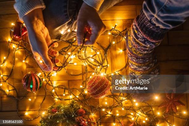 getting ready for christmas and new year celebration - untangle stockfoto's en -beelden