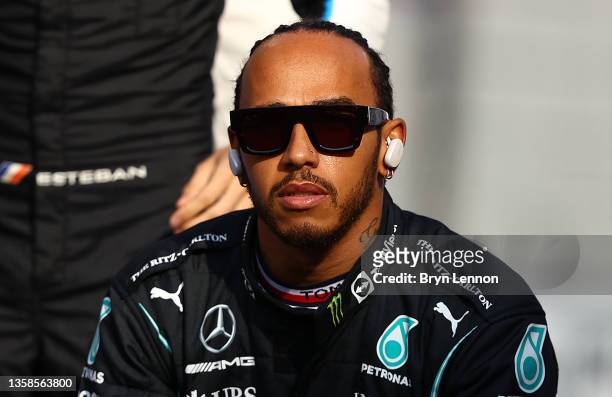 Lewis Hamilton of Great Britain and Mercedes GP looks on during the end of season drivers picture during the F1 Grand Prix of Abu Dhabi at Yas Marina...