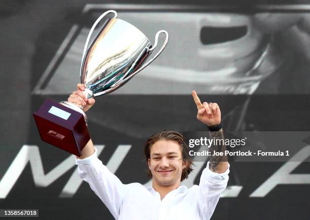 Champion Dennis Hauger of Norway and Prema Racing celebrates during the prize giving ceremony of the Formula 3 Championship at Yas Marina Circuit on...