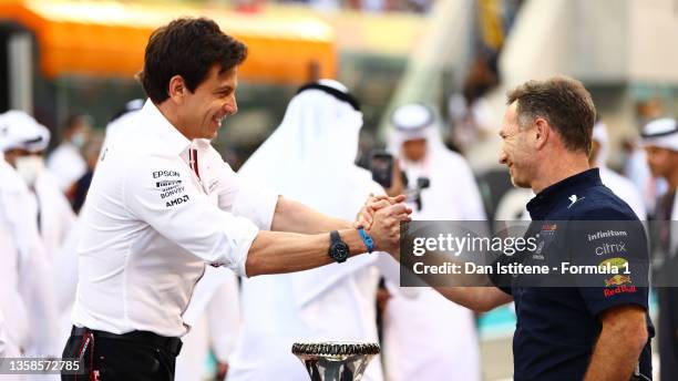 Mercedes GP Executive Director Toto Wolff and Red Bull Racing Team Principal Christian Horner shake hands on the grid before the F1 Grand Prix of Abu...