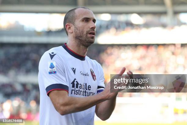 Lorenzo De Silvestri of Bologna FC applauds the fans following the final whistle of the Serie A match between Torino FC and Bologna FC at Stadio...