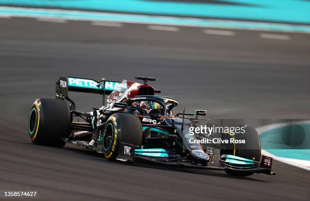 Lewis Hamilton of Great Britain driving the Mercedes AMG Petronas F1 Team Mercedes W12 during the F1 Grand Prix of Abu Dhabi at Yas Marina Circuit on...