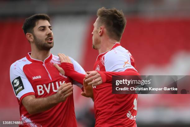 Marvin Pourie of FC Wuerzburger Kickers celebrates after scoring his team`s first goal with teammate Moritz Heinrich of FC Wuerzburger Kickers during...