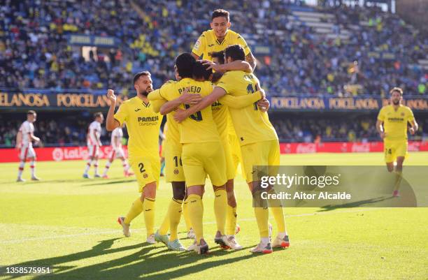 Aissa Mandi of Villarreal CF celebrates after scoring their sides first goal with team mates during the La Liga Santander match between Villarreal CF...