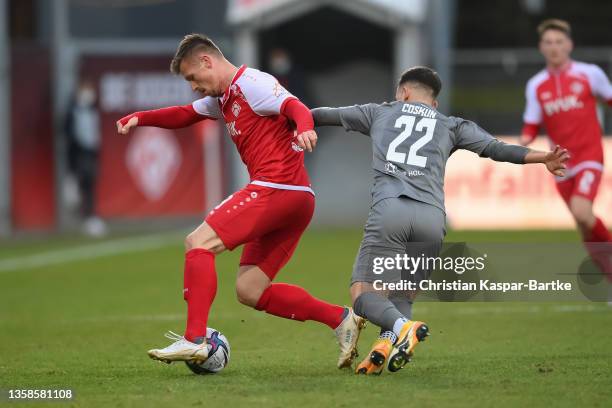 Marvin Pourie of FC Wuerzburger Kickers cchallenges Can Coskun of FSV Zwickau during the 3. Liga match between Würzburger Kickers and FSV Zwickau at...