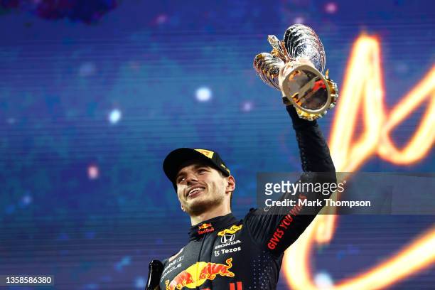 Race winner and 2021 F1 World Drivers Champion Max Verstappen of Netherlands and Red Bull Racing celebrates on the podium during the F1 Grand Prix of...