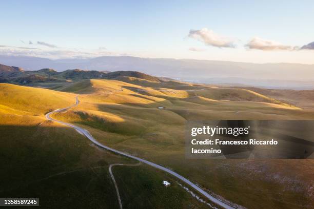 campo imperatore. gran sasso e monti della lega national park, landscape at sunset. abruzzo, italy. aerial view - abruzzo national park stock pictures, royalty-free photos & images