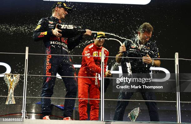 Race winner and 2021 F1 World Drivers Champion Max Verstappen of Netherlands and Red Bull Racing celebrates with Red Bull Racing Team Principal...