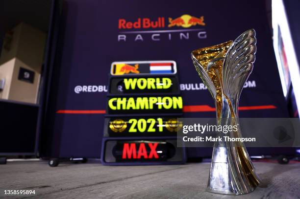 The race winners trophy is pictured in front of a pitboard for 2021 F1 World Drivers Champion Max Verstappen of Netherlands and Red Bull Racing...