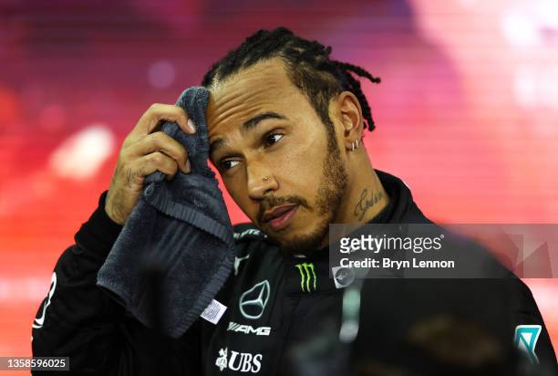 Second placed and championship runner up Lewis Hamilton of Great Britain and Mercedes GP looks dejected in parc ferme during the F1 Grand Prix of Abu...