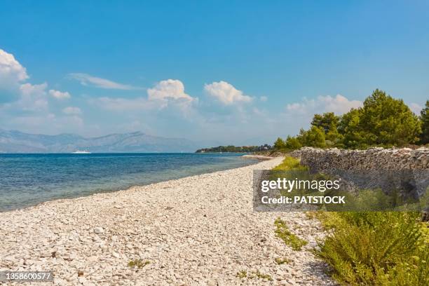 pebble beach by the adriatic sea in mirca village, brac island, croatia. - brac eiland stockfoto's en -beelden