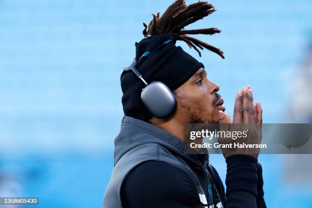 Cam Newton of the Carolina Panthers warms up before the game against the Atlanta Falcons at Bank of America Stadium on December 12, 2021 in...