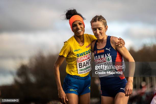 Karoline Bjerkeli Grovdal of Norway and Meraf Bahta of Sweden celebrates after Women Senior race during SPAR European Cross Country Championships...