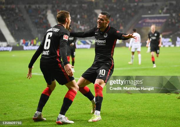 Kristijan Jakic of Frankfurt celebrates scoring his team's fourth goal with Filip Kostic during the Bundesliga match between Eintracht Frankfurt and...