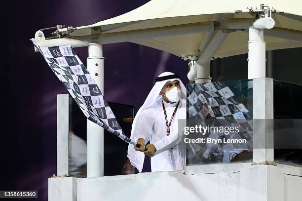 The chequered flag is waved during the F1 Grand Prix of Abu Dhabi at Yas Marina Circuit on December 12, 2021 in Abu Dhabi, United Arab Emirates.