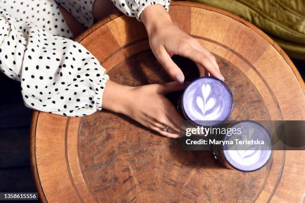 foamed coffee in trendy 2022 purple very peri color. - concept updates stock pictures, royalty-free photos & images