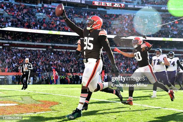 Myles Garrett of the Cleveland Browns celebrates after running the ball in for a touchdown after a fumble recovery in the second quarter against the...