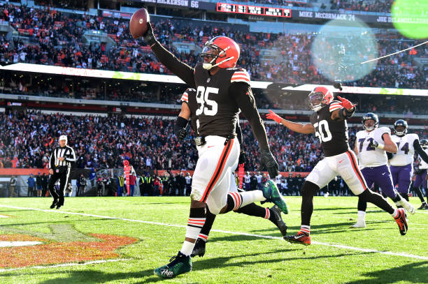 Myles Garrett of the Cleveland Browns celebrates after running the ball in for a touchdown after a fumble recovery in the second quarter against the...