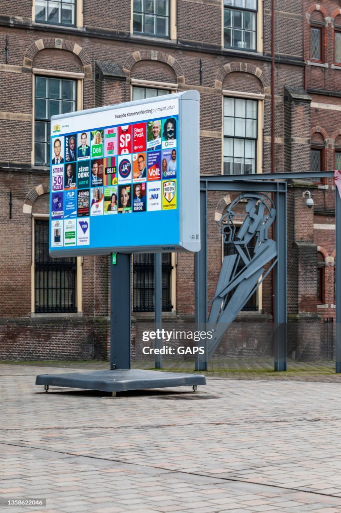 Billboard with election posters near Binnenhof, center of politics in the Netherlands, in The Hague