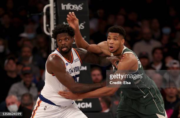 Julius Randle of the New York Knicks and Giannis Antetokounmpo of the Milwaukee Bucks fight for position in the second half at Madison Square Garden...