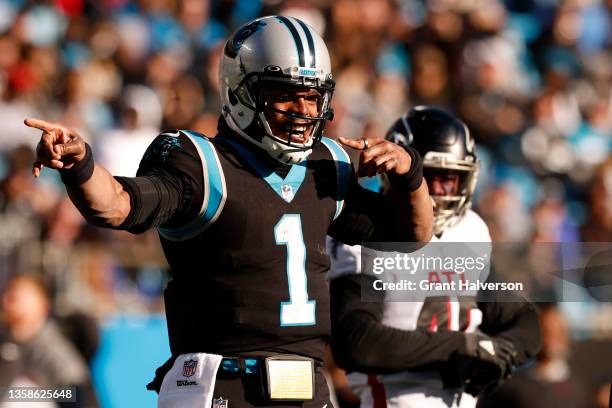 Cam Newton of the Carolina Panthers celebrates after rushing for a first down in the third quarter of the game against the Atlanta Falcons at Bank of...