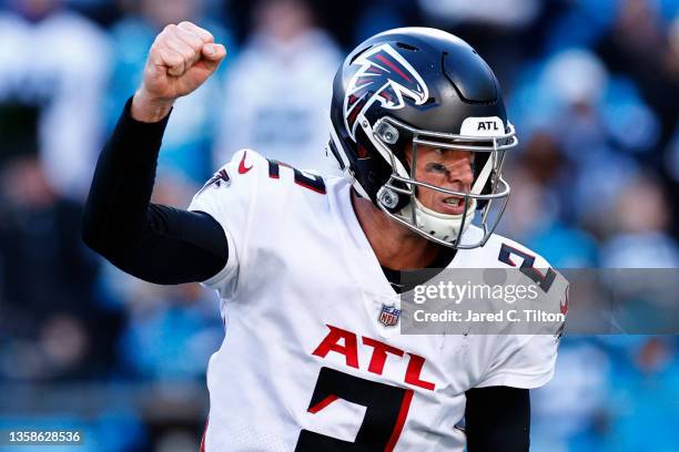 Matt Ryan of the Atlanta Falcons celebrates a three-yard pass to Hayden Hurst for a touchdown over the Carolina Panthers in the fourth quarter of the...