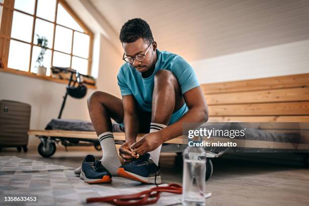 man wearing shoes preparing for workout - men shoes stock pictures, royalty-free photos & images