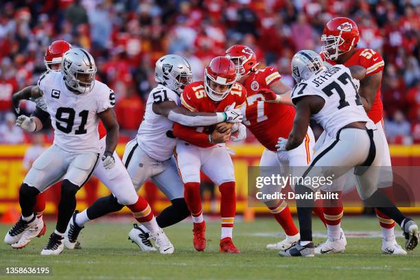 Patrick Mahomes of the Kansas City Chiefs is sacked by Malcolm Koonce of the Las Vegas Raiders during the third quarter at Arrowhead Stadium on...