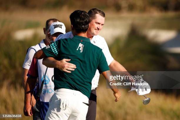Jason Kokrak of the United States and Kevin Na of the United States celebrate after finishing on the 18th green on their way to winning in the final...
