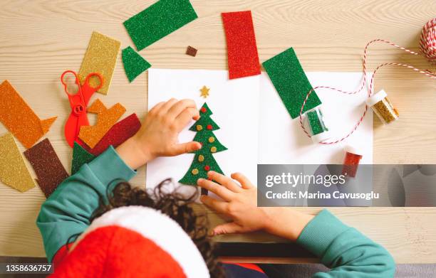 little kid making christmas card. easy diy ideas. - art and craft stock pictures, royalty-free photos & images