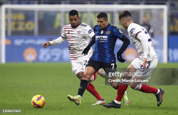 Alexis Sanchez of Internazionale is challenged by Dalbert and Adam Obert of Cagliari during the Serie A match between FC Internazionale and Cagliari...