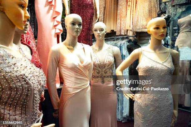 mannequin of formal dress in a clothing store window - fashion district stock pictures, royalty-free photos & images