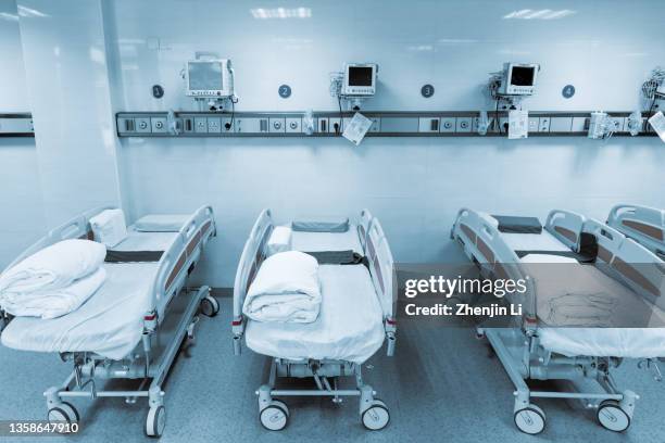 hospital emergency room with ward beds and medical equipments - icu ward stock pictures, royalty-free photos & images