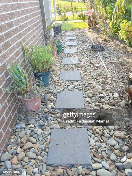 concrete pavers in garden sideway - brick pathway stock pictures, royalty-free photos & images