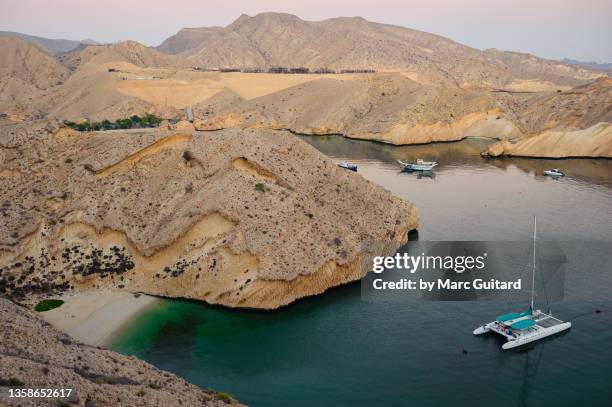 desert shoreline near muscat, oman - oman muscat stock pictures, royalty-free photos & images