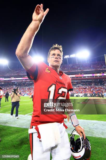 Tom Brady of the Tampa Bay Buccaneers celebrates after defeating the Buffalo Bills 33-27 in overtime at Raymond James Stadium on December 12, 2021 in...